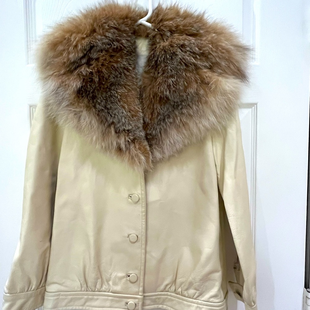 Adorable leather jacket with possible real fur.